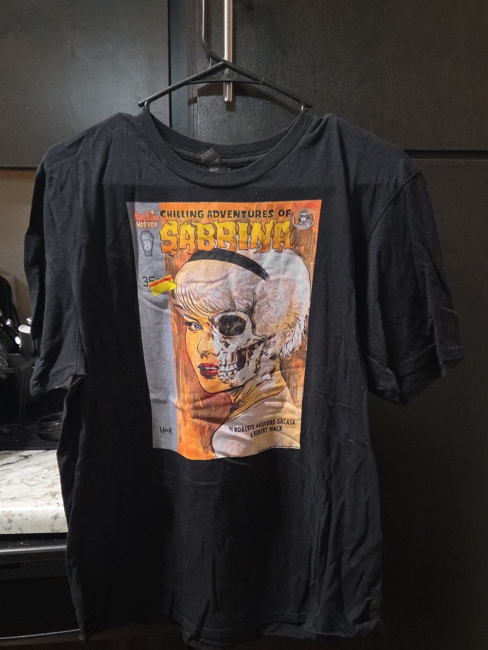 Hot Topic Black Short-Sleeve Tee with Orange and Cream Sabrina Graphic